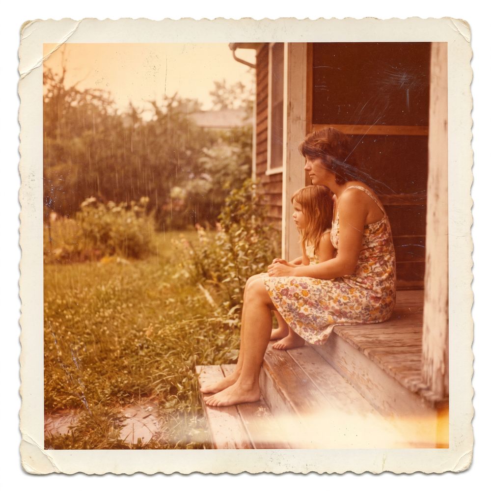 My mother and me on her porch step, some time around 1978. We are watching it rain, which is most of what we did.